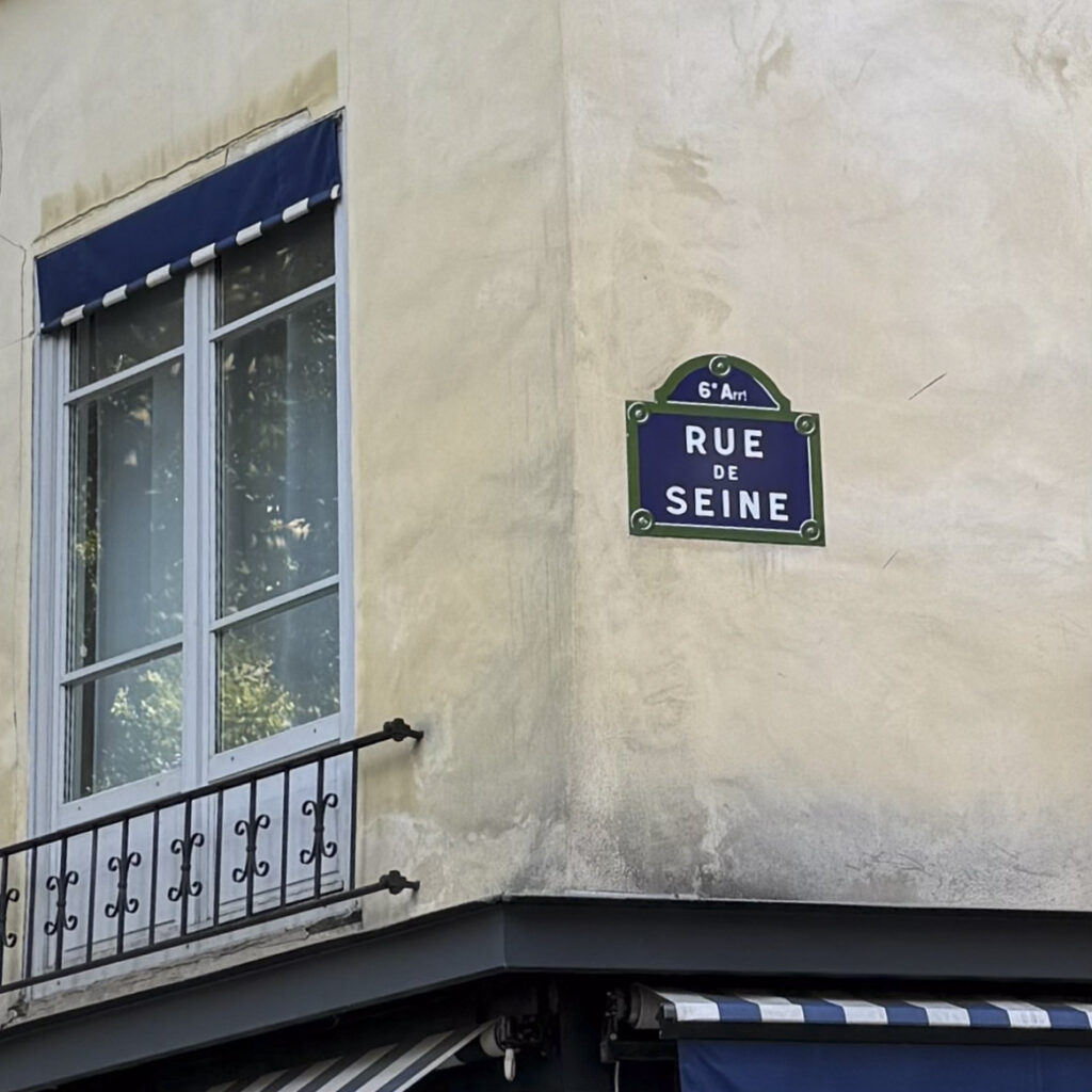 The Rue de Seine traditional enamel street sign.