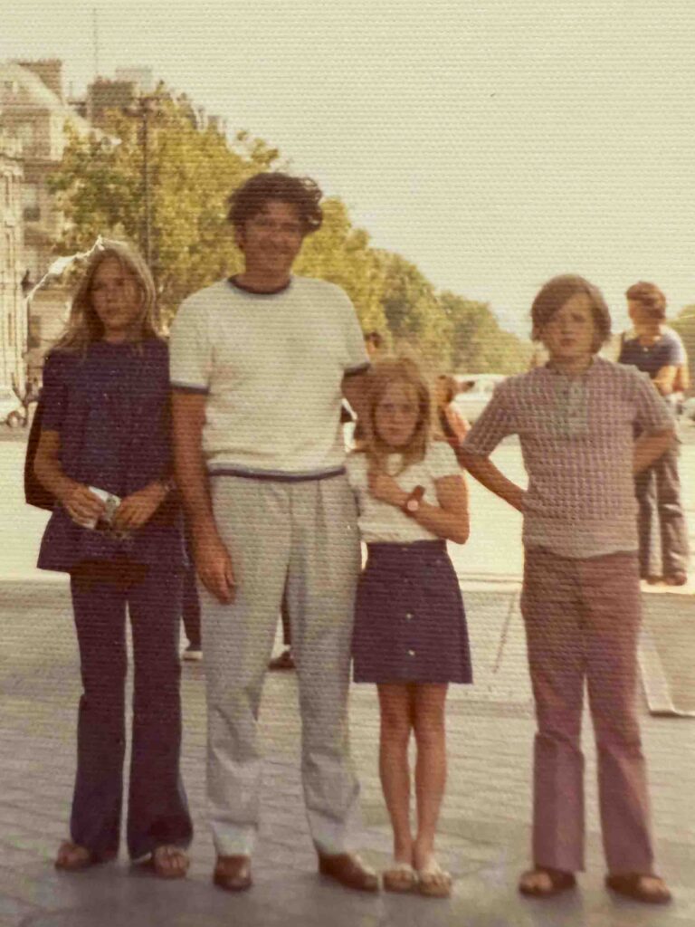 Family group photo under the Arch de Triomphe, Paris
