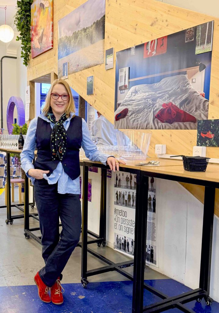 Portrait of the artist in front of her photographic work The Red Shoe